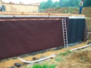 01/06/2010 - préparation du mur contre terre avant drainage